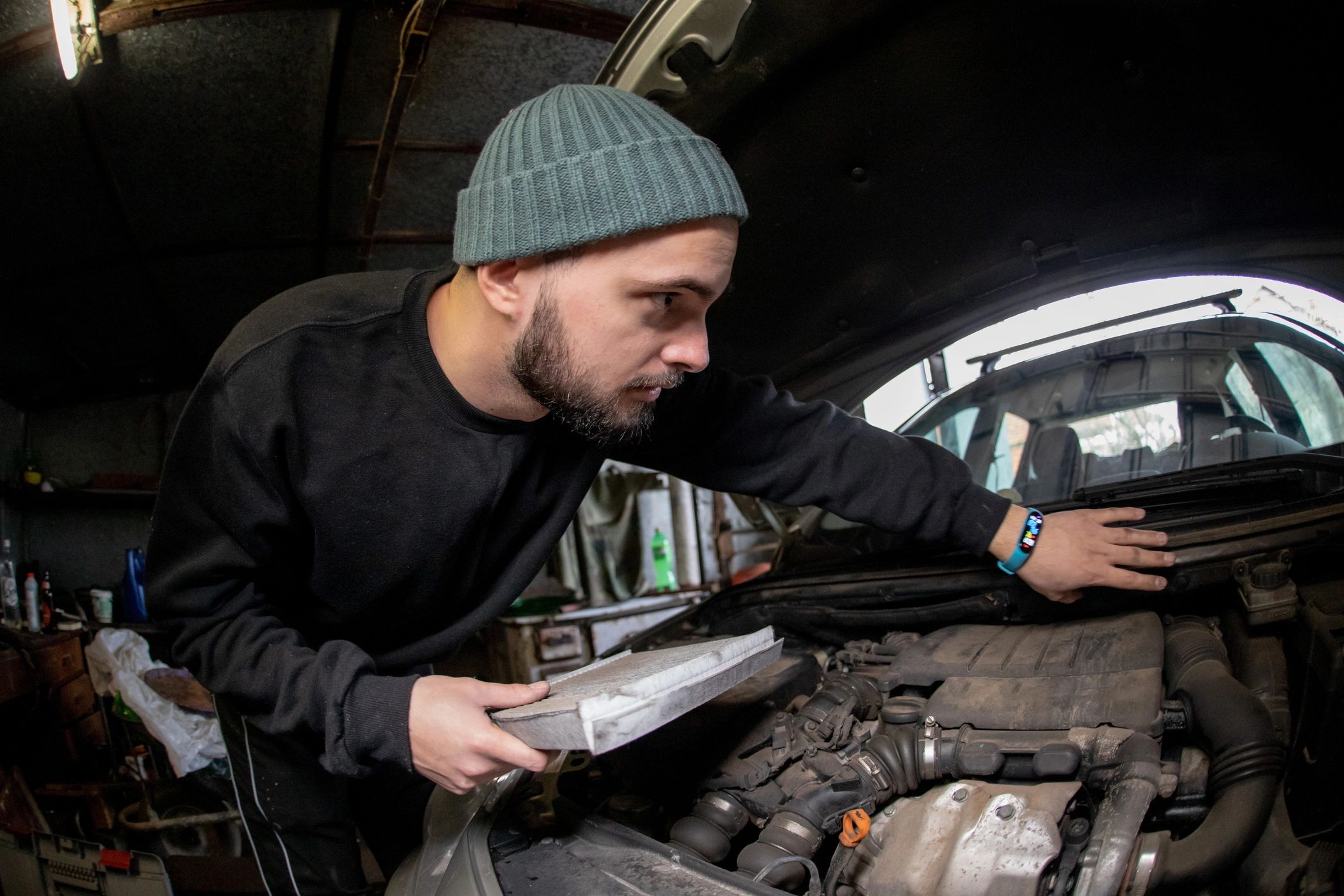 Technician performing car diagnostics and programming support